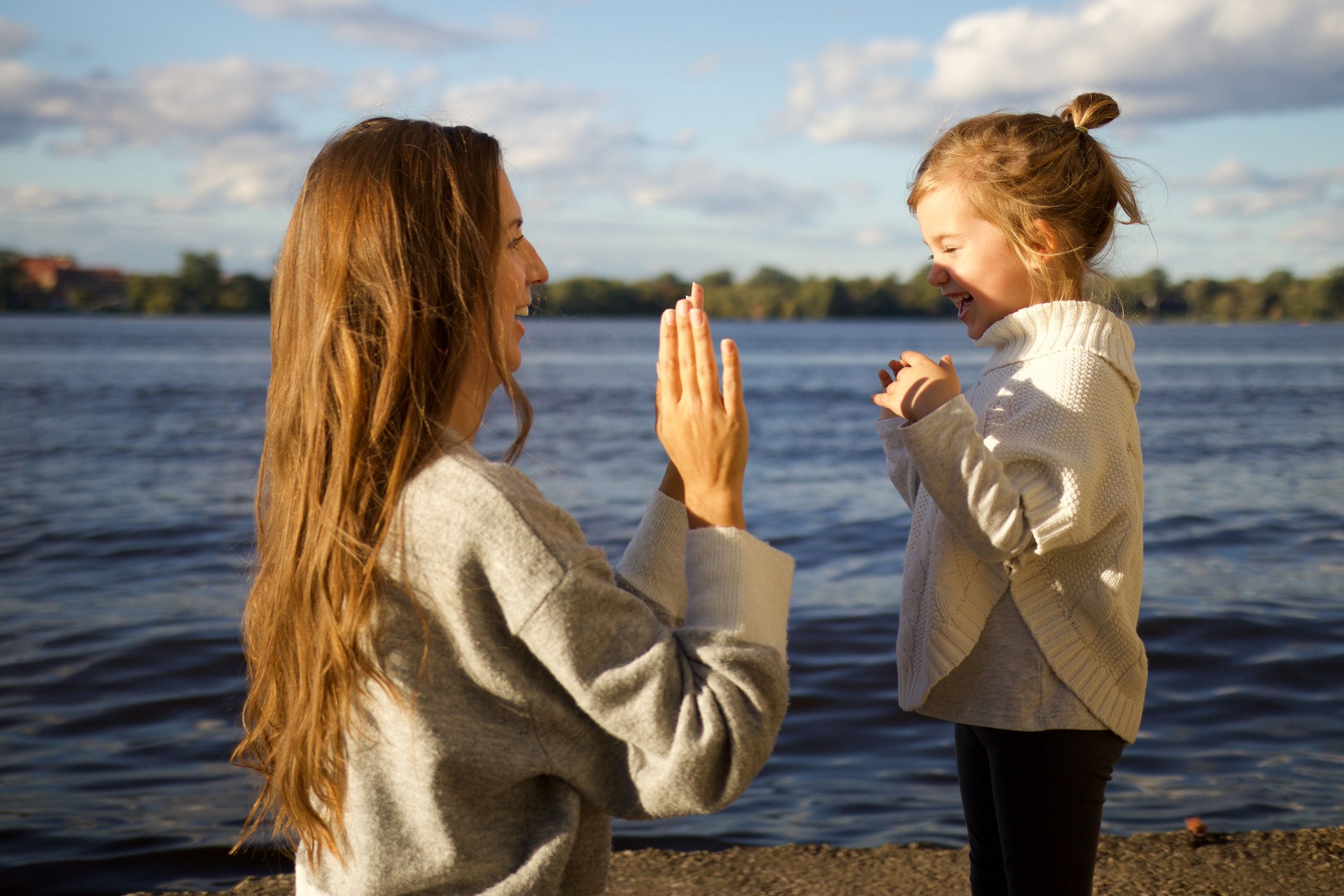 Mom and daughter on the sea lakeshore