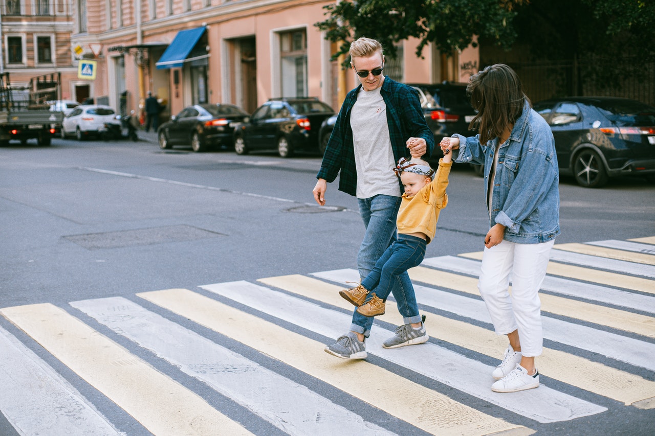 Family walking on the pedestrian lane
